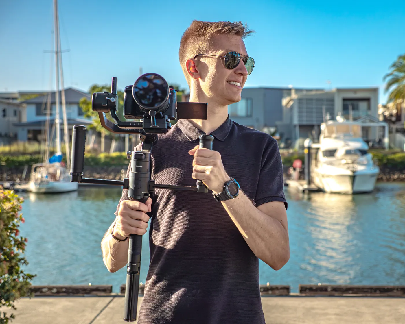 Cameron van Hooft holding his camera on a gimbal